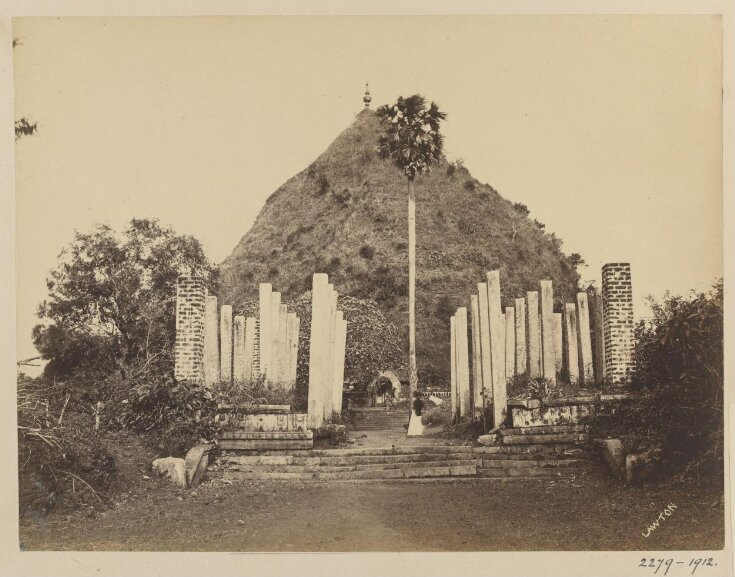 Anuradhapura- The Ruwanweli Dágoba. East view, with ruins of pillared hall. This is the most celebrated Dágoba in Ceylon, and it is believed that at the present time it contains treasures of untold value. It was begun by Dutugemenu 160 years before the Christian era, and was finished in the year 137 B.C. It is composed of sold brick-work rising to a height of more than 150 feet, with a diameter, at the base, of 379 feet. top image