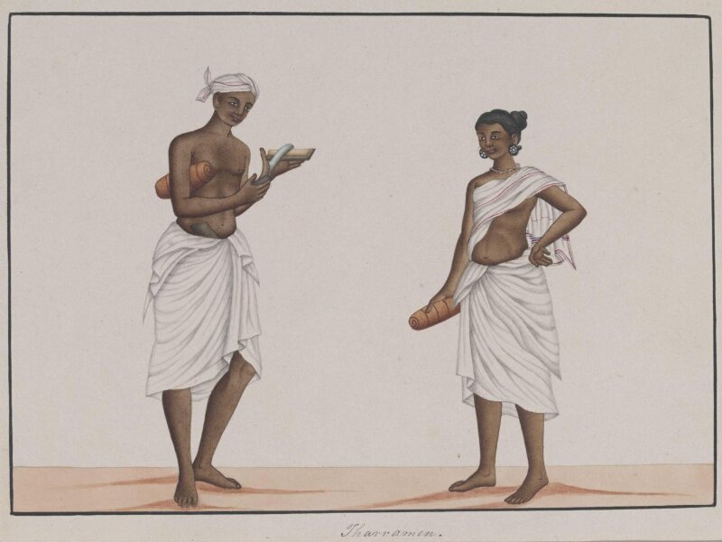 A man and woman carrying rolled mats