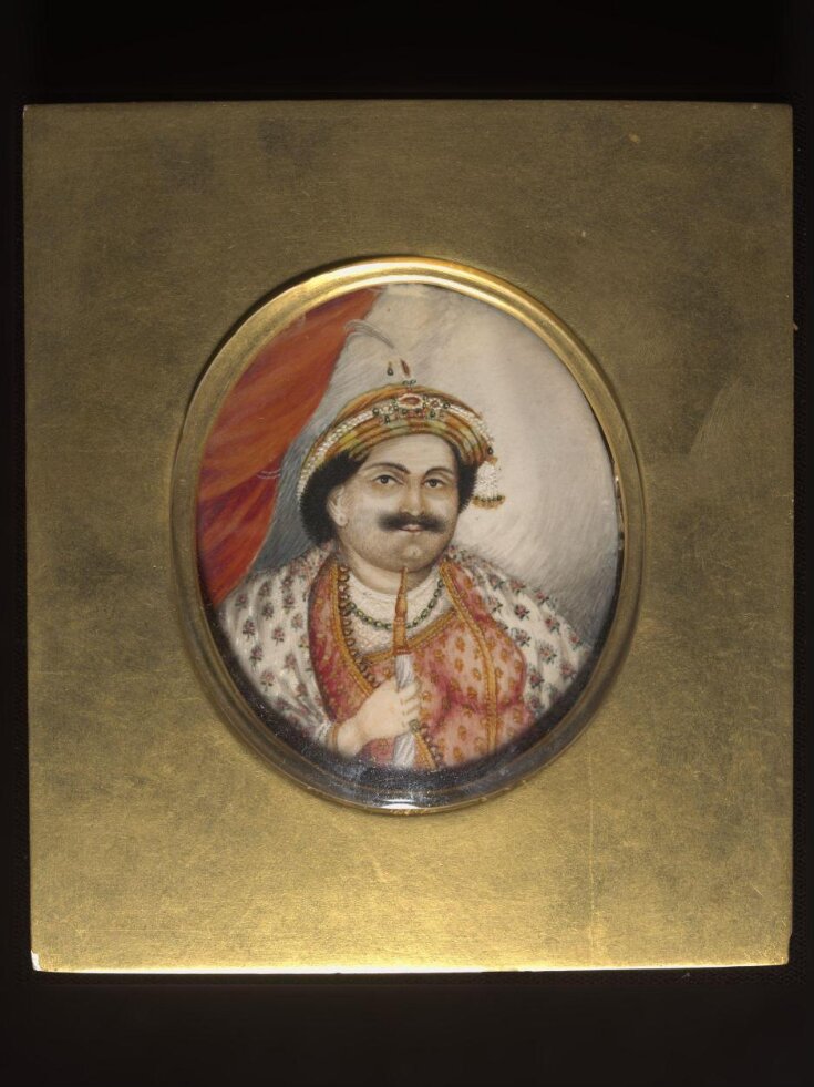 This head and shoulders portrait of Raja Udit Narain Singh of Benares (1795-1835) smoking a huqqa. top image