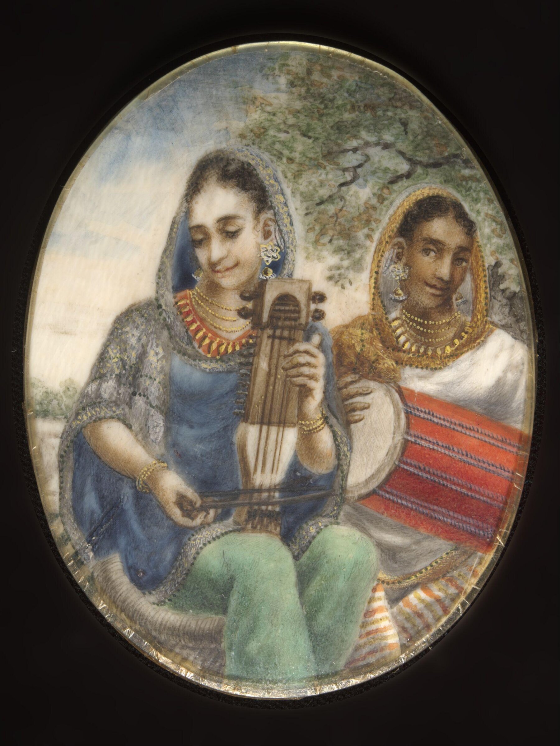 Two Indian ladies, one with a drum, the other with a sarangi., ca. 1860
