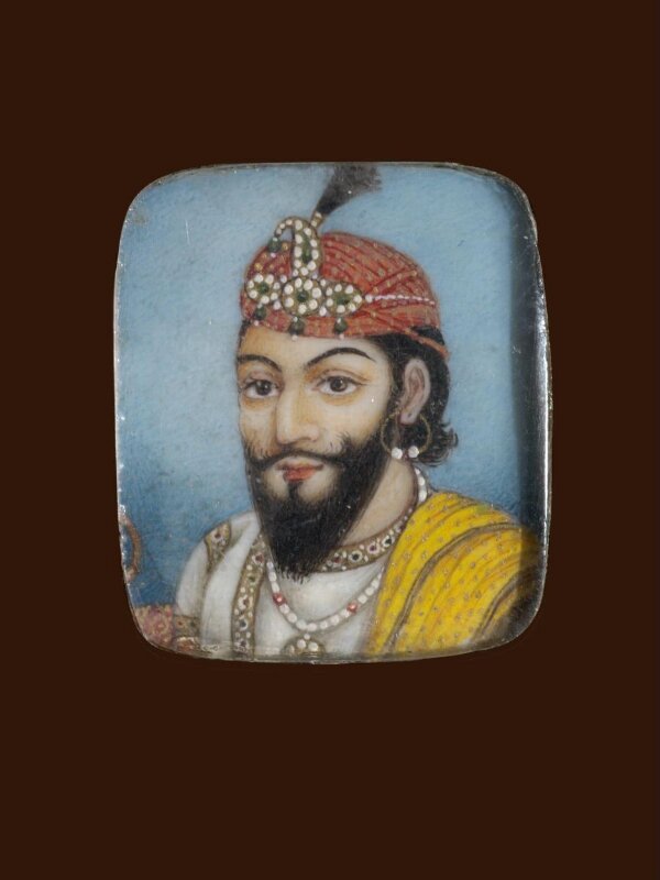 A wooden panel containing ten ivory miniatures, formerly mounted in two bracelets, depicting Indian rulers.