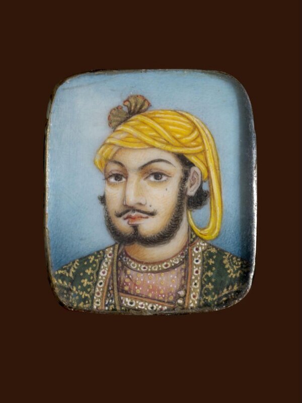 A wooden panel containing ten ivory miniatures, formerly mounted in two bracelets, depicting Indian rulers.