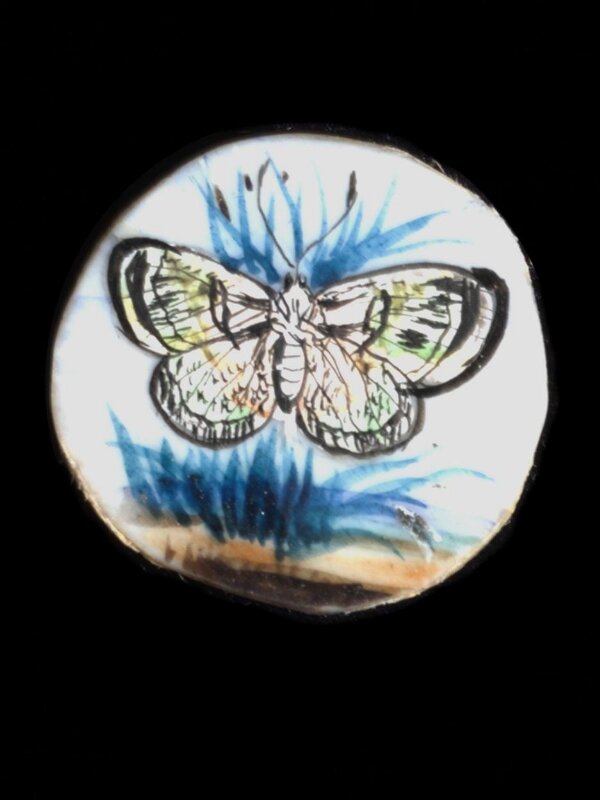 One of twenty-six ivory buttons painted with butterflies.