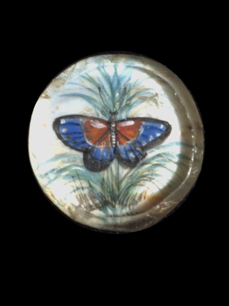 One of twenty-six ivory buttons painted with butterflies. top image