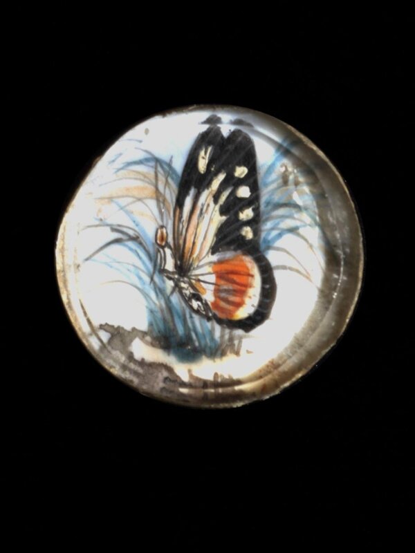 
One of twenty-six ivory buttons painted with butterflies.
