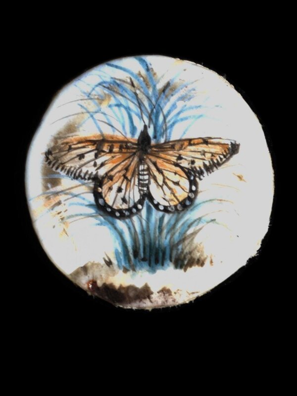 One of twenty-six ivory buttons painted with butterflies.