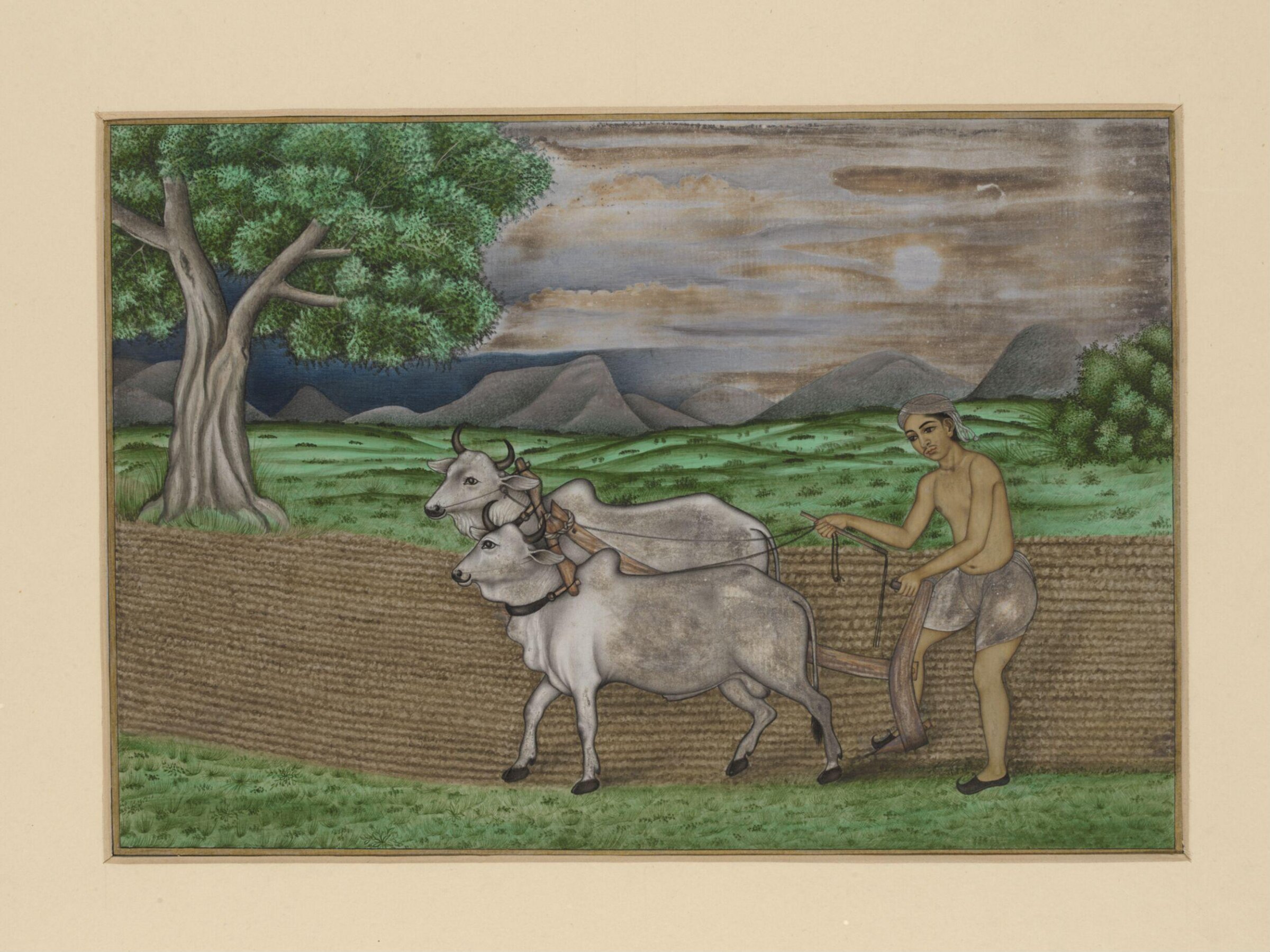 A villager ploughing with two bullocks; a hilly landscape in the background., ca.1860