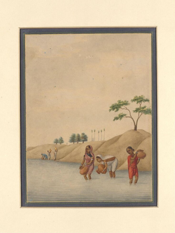 A woman drawing water from a well top image