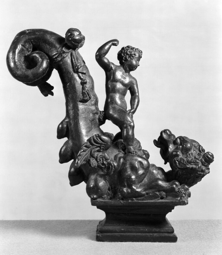 Putto (or boy) standing on a dragon top image