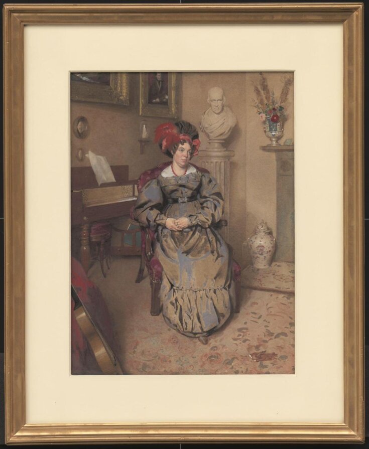 Portrait of a lady seated in an armchair top image