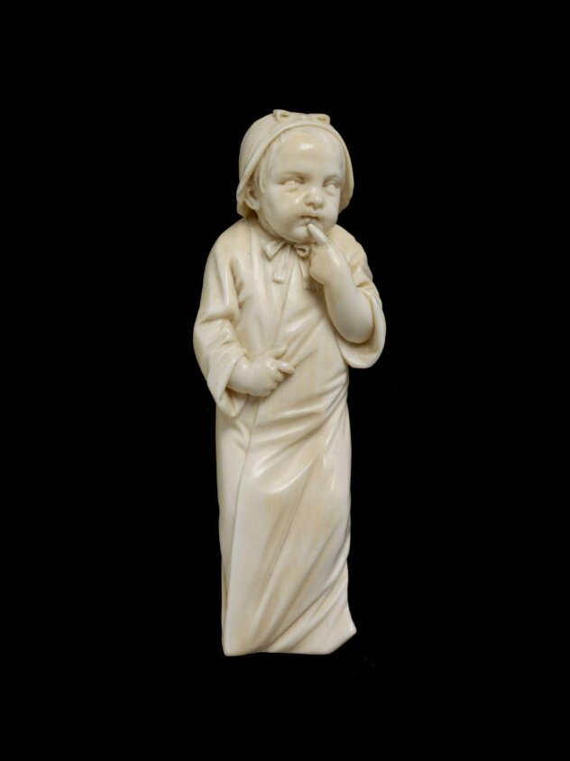 Small girl with finger at her mouth