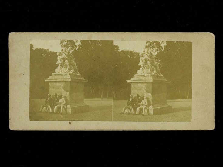 Stereoscopic photograph depicting three men in a public square top image