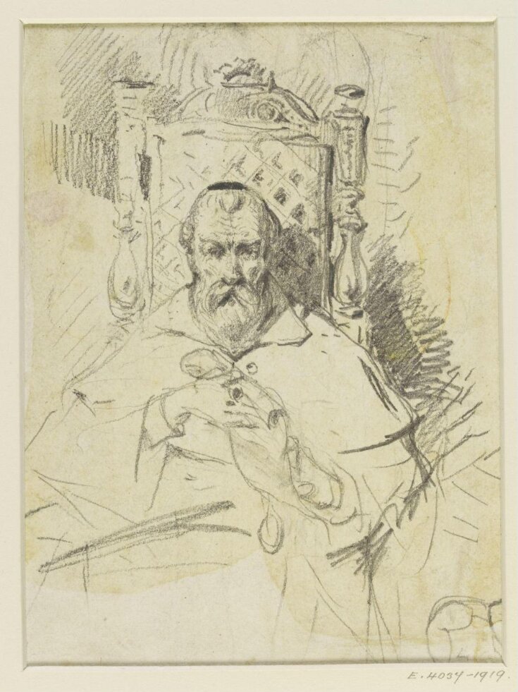 An old man seated in a chair top image