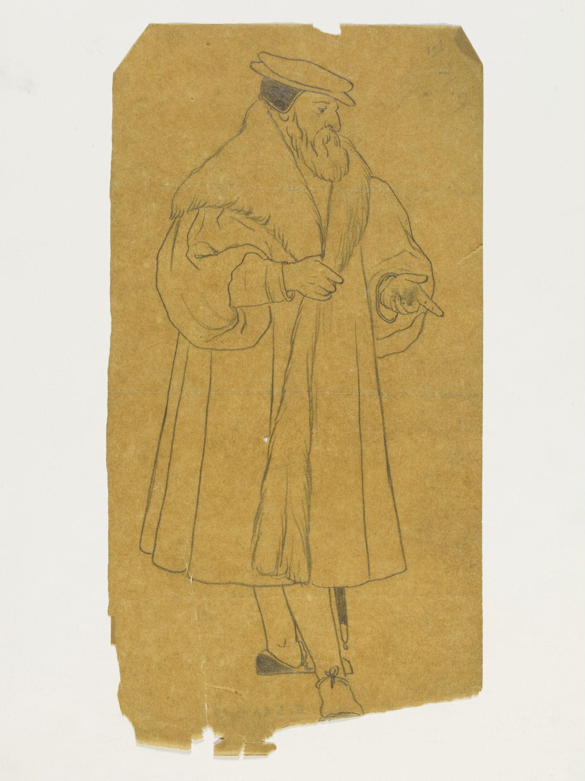A bearded man in costume, wearing a hat