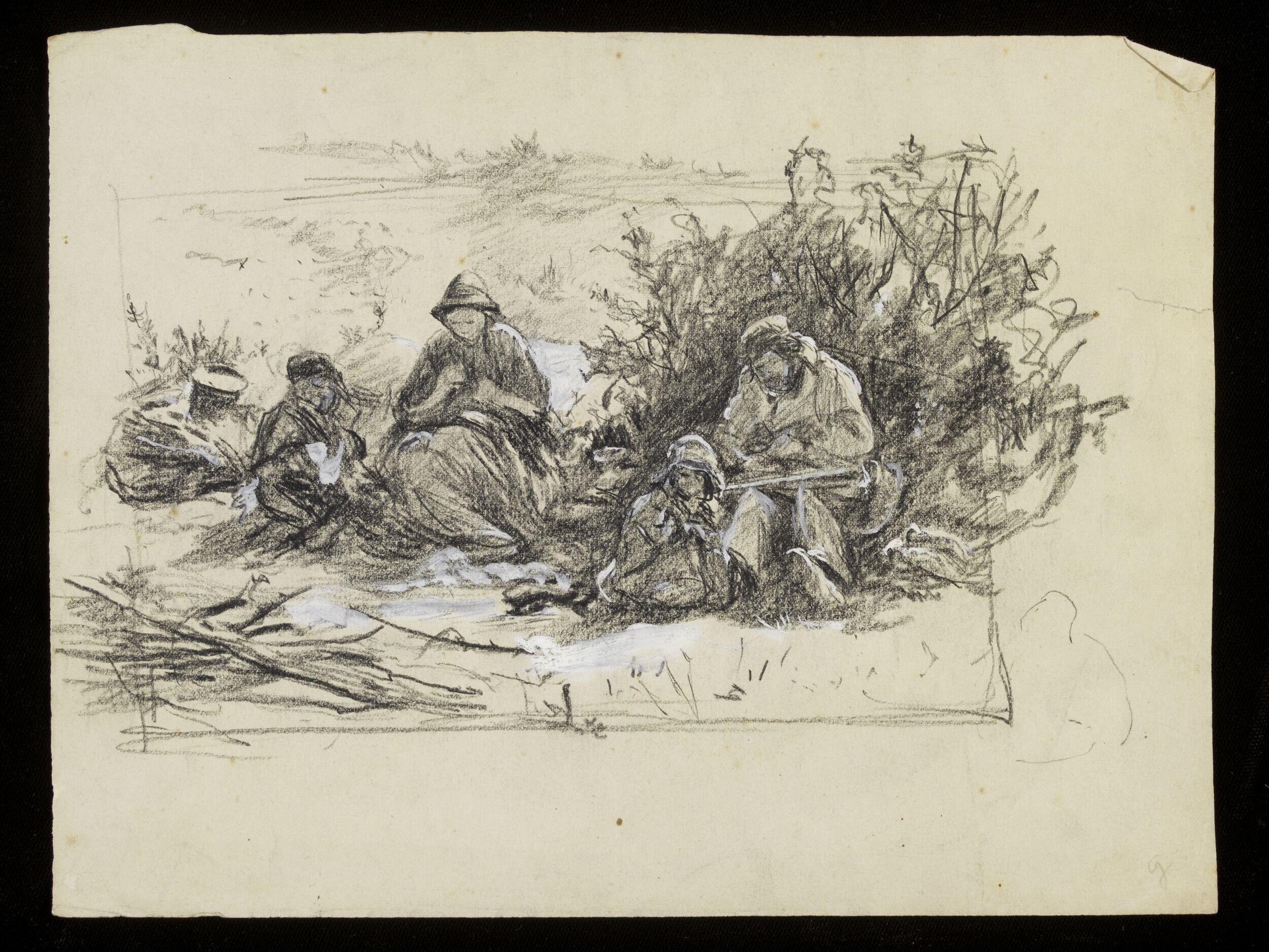 Men sitting in a field