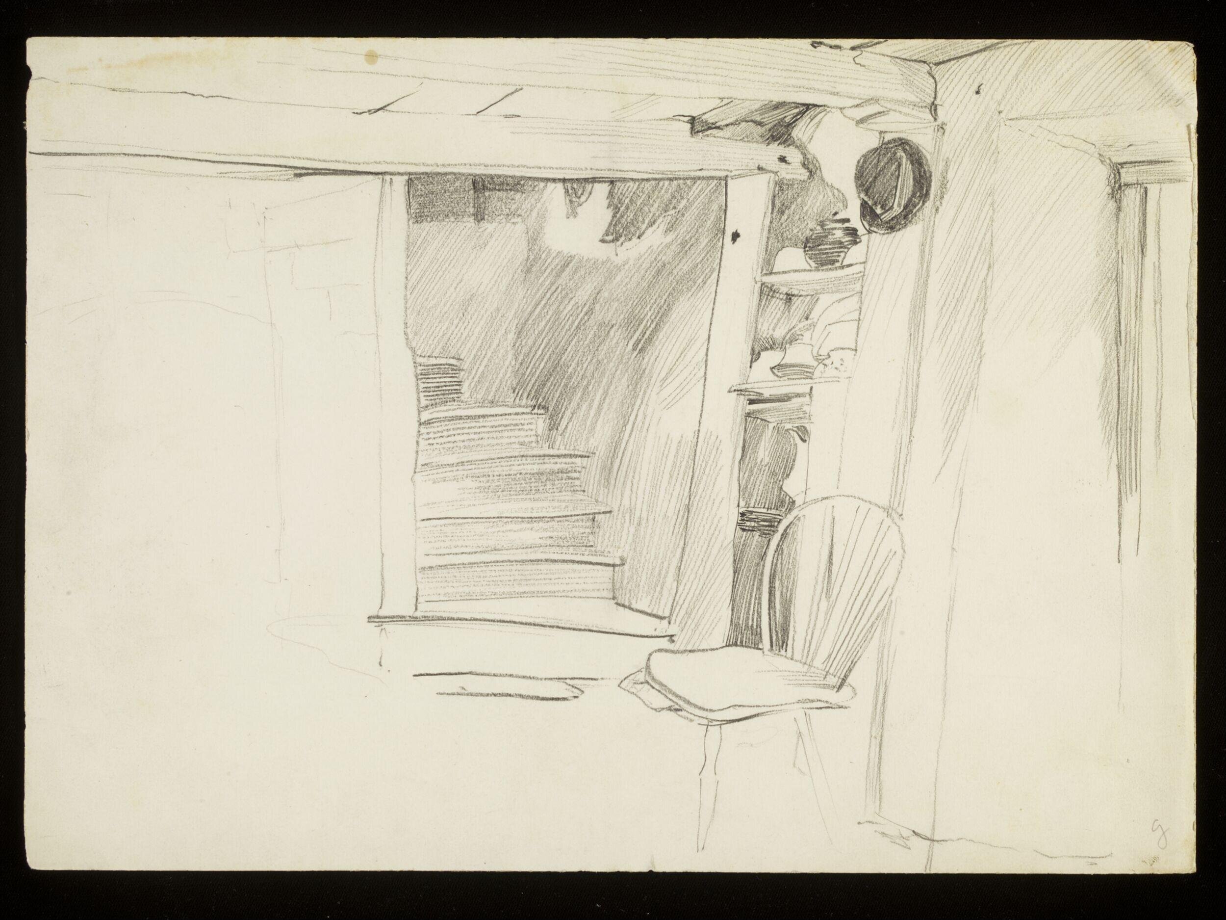 Bottom of a staircase with a hat and chair