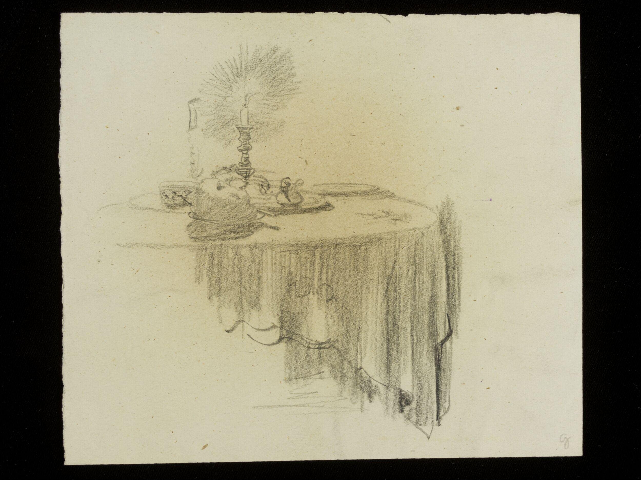 Table with a burning candle on top