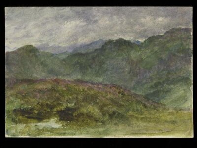 A Mountainous range under a heavy sky