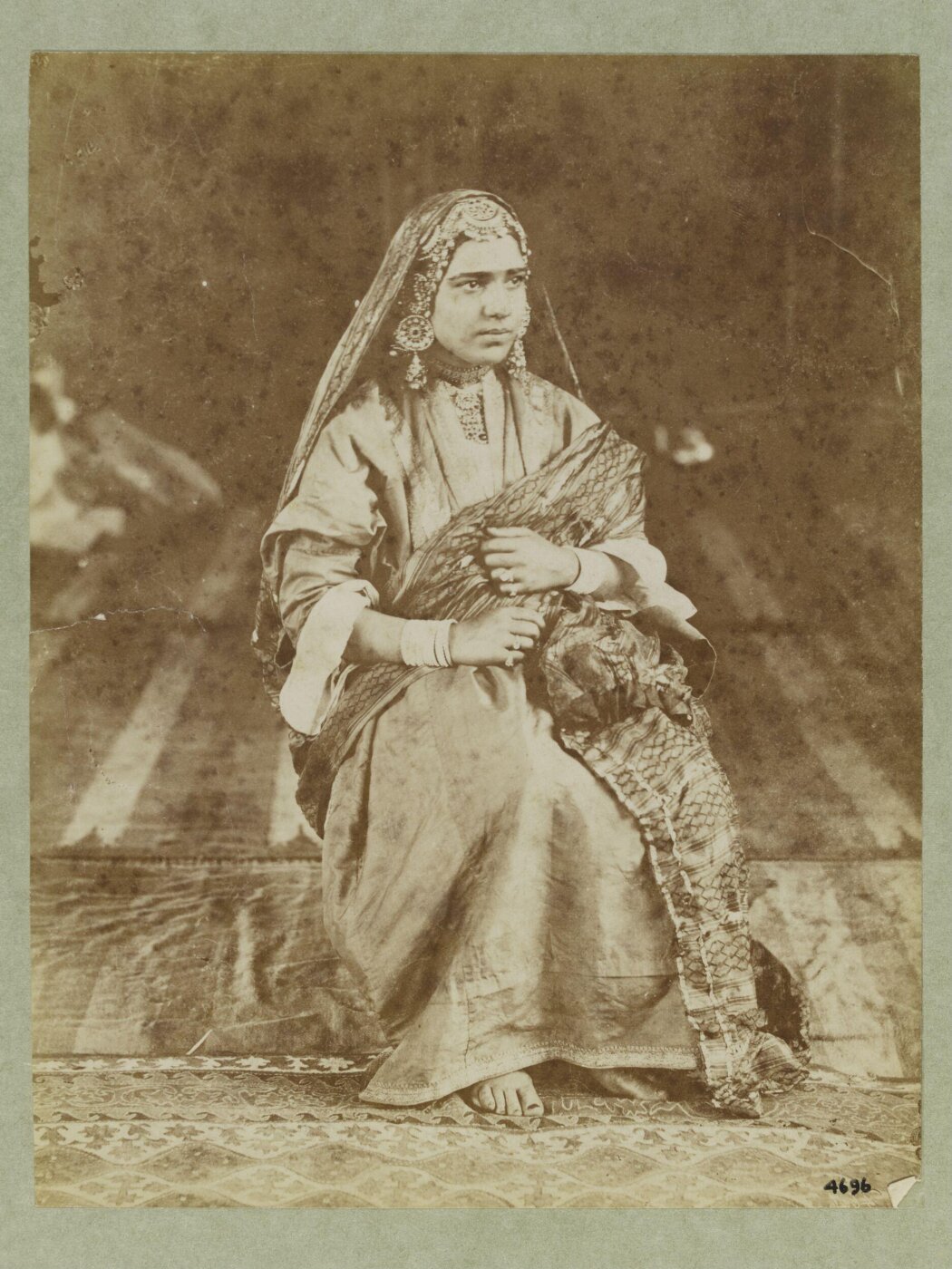 Unknown, A woman from North West India seated in formal wedding(?) dress.