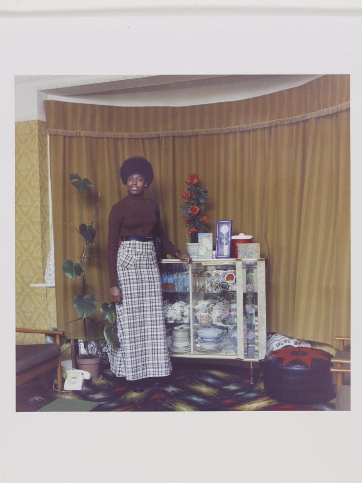 Untitled [Young Jamaican lady standing in her mother's front room in Brixton Hill] top image