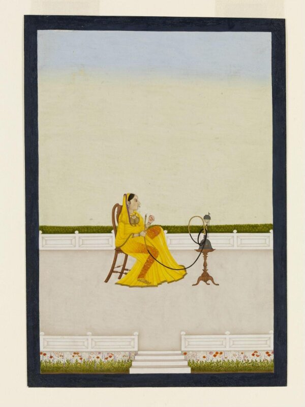 Mahatt seated on a chair