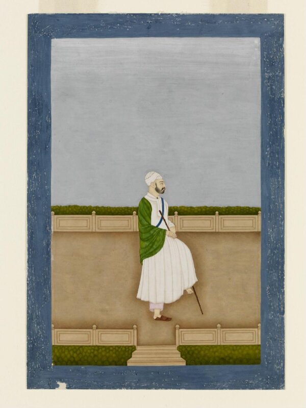 A man in white robe and turban