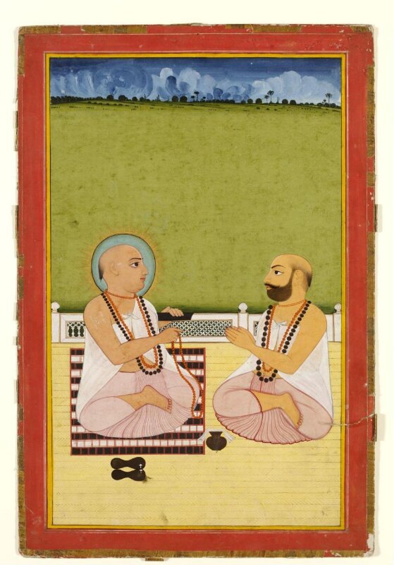 Holy man and pupil on a terrace