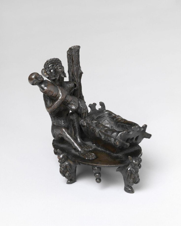 Inkstand with a monkey taking a baby from its cradle top image