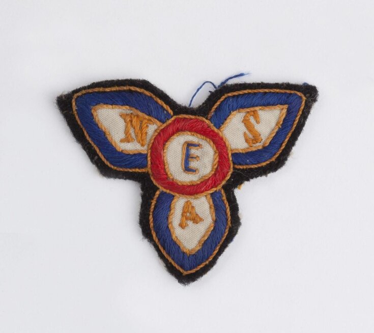 Wartime uniform badge for the Entertainments National Services Association top image