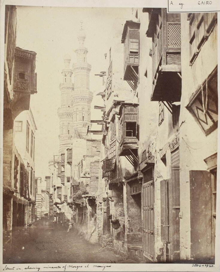 Street view showing the minarets of the mosque of Mamluk Sultan al-Mu'ayyad Shaykh, Cairo top image