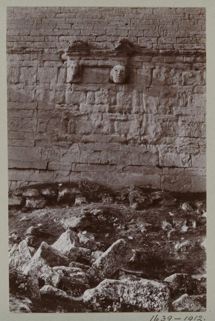 Two bas-relief masks on the south wall of a room in the Great Iwan at Hatra, Iraq top image