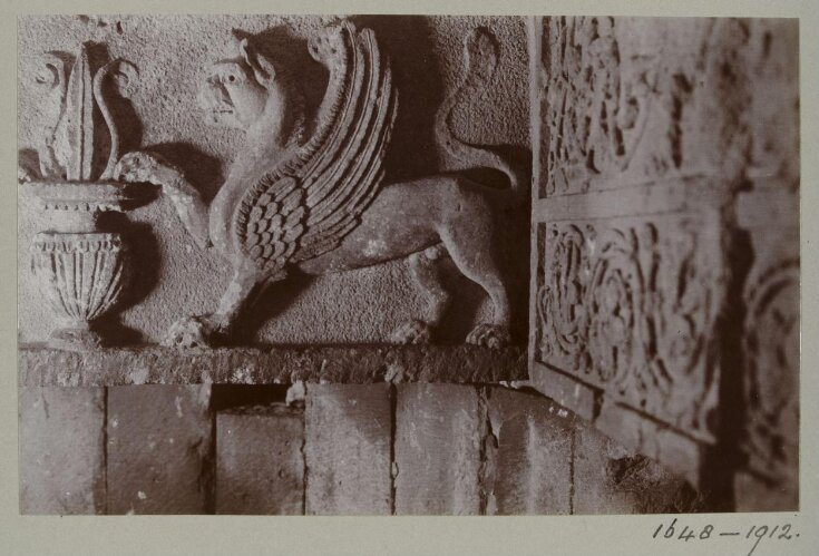 Detail of a large stone lintel carved with a lion-griffin and lotus-filled vase in Room 10 in the ruins of the Great Iwan at Hatra, Iraq top image