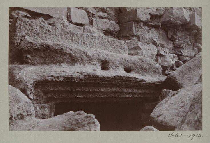  Detail of a carved lintel at the entrance to Room 5 in the ruins of the Great Iwan at Hatra, Iraq, top image