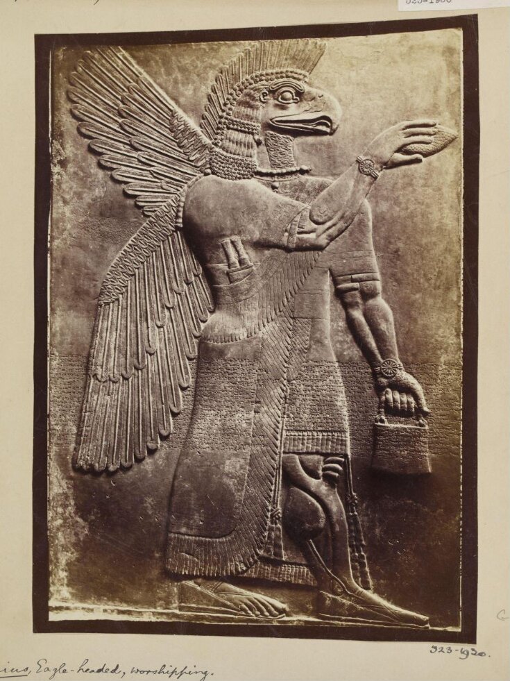 Assyrian sculpture of an eagle-headed genius, worshipping, Paris, Louvre top image