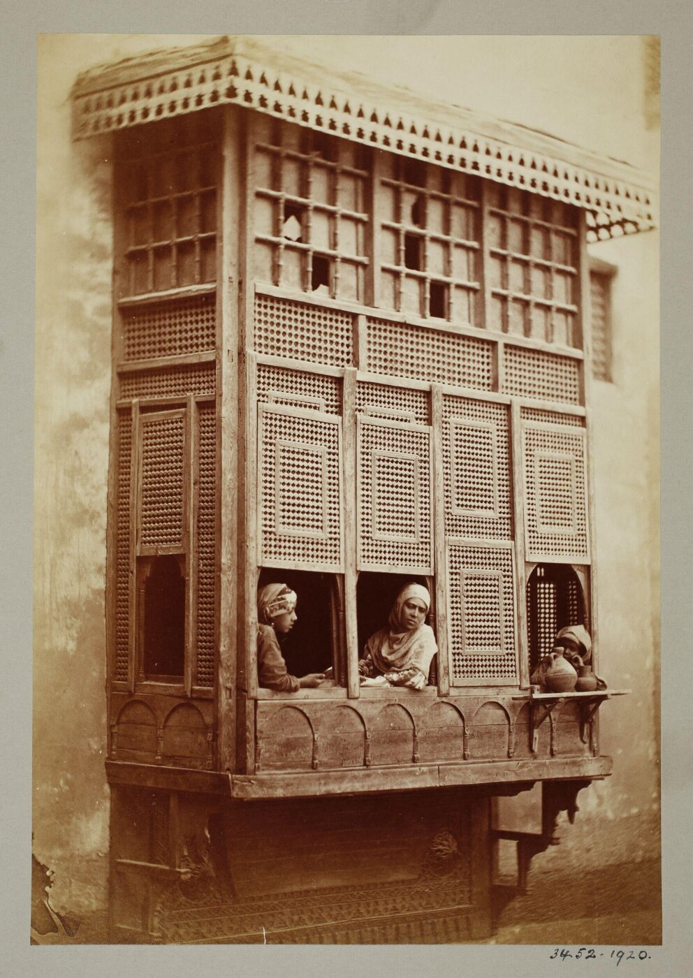 Unknown, Women looking out from a mushrabiyya (window), Cairo