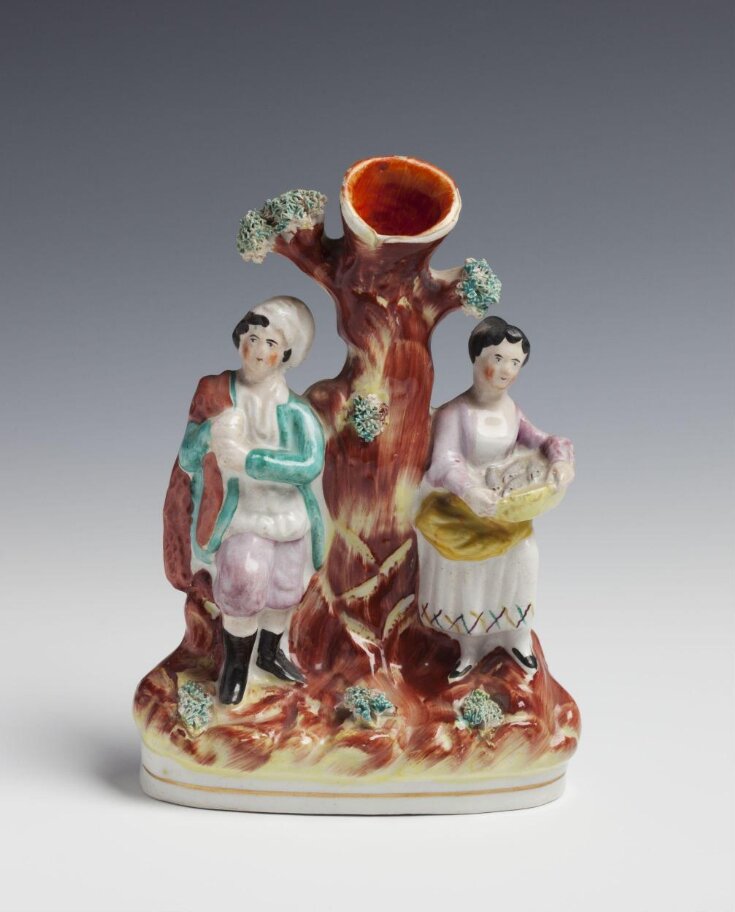 Glazed earthenware spill vase of a fisherman and his wife top image