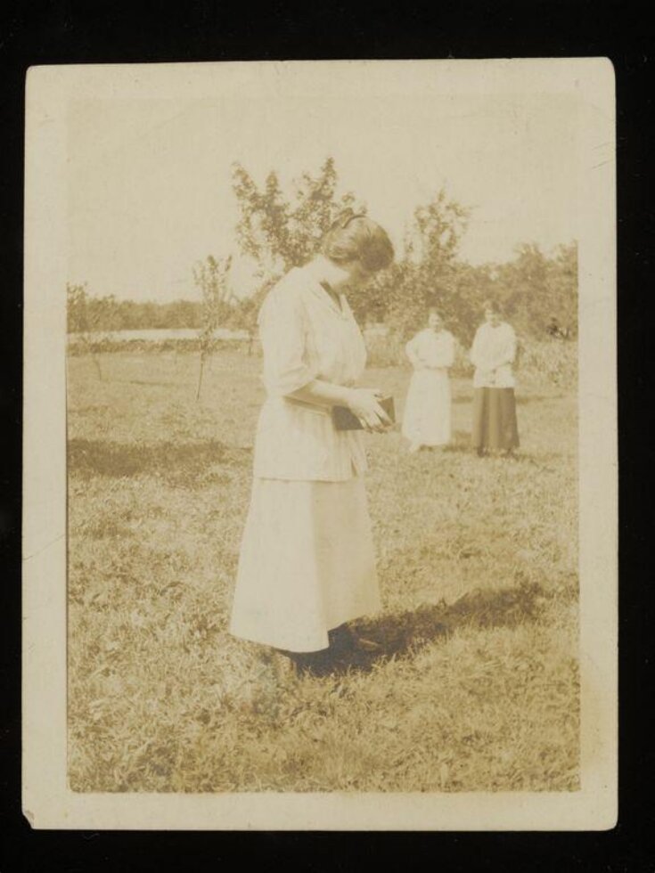 Woman using a pinhole camera top image