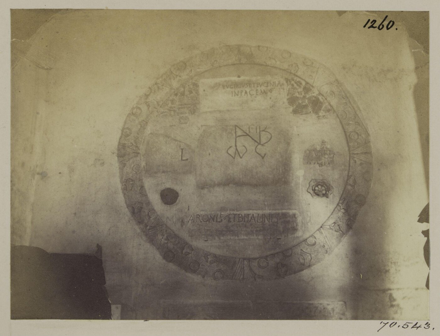 Parker, John Henry, Church of S. Giorgio in Velabro - Carved Frame of a circular Window, c. A.D. 1295, filled up with fragments of early Tombstone from the Catacombs.