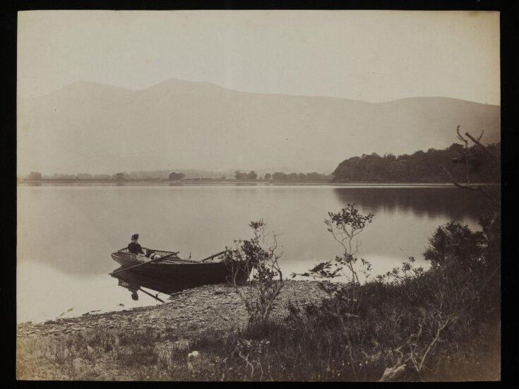 Photograph of Beatrix Potter (1866-1943) and dog, 'Spot', in a boat on Derwentwater top image
