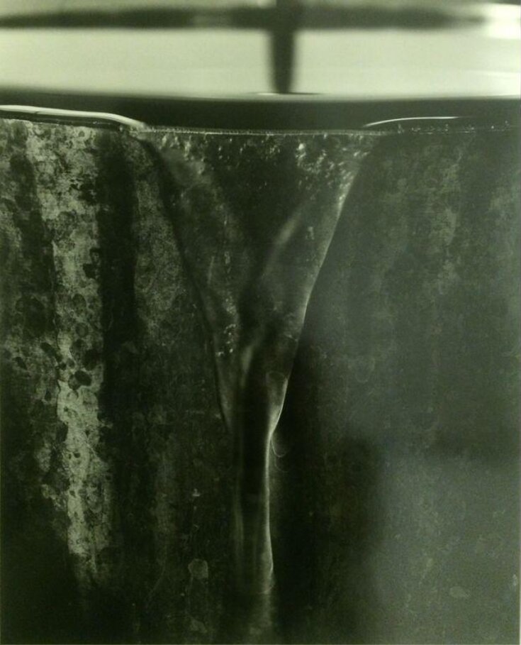 Water Pouring Out of a Pot top image