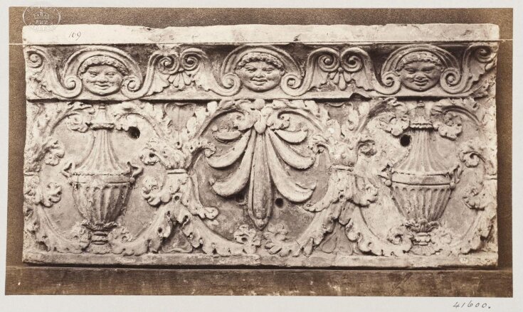 Bas-relief of portion of frieze with acanthus ornament enclosing vases ...