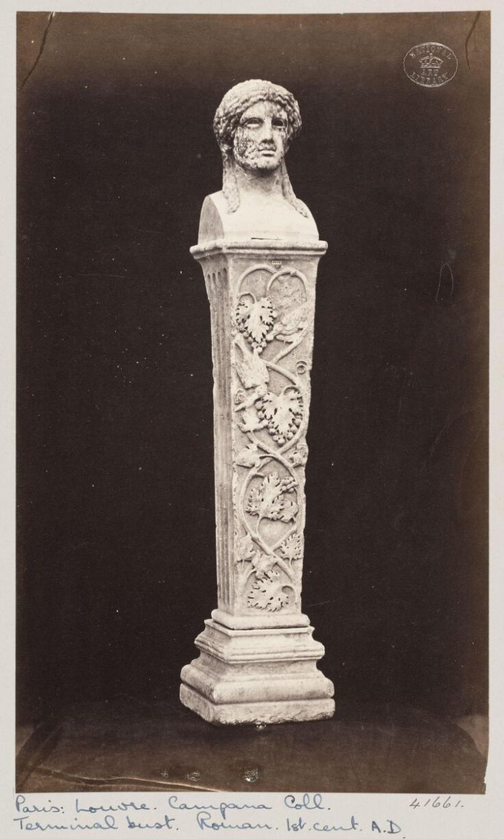 Marble herma with the head of Baccus ornamented with vine leaves and fruit top image