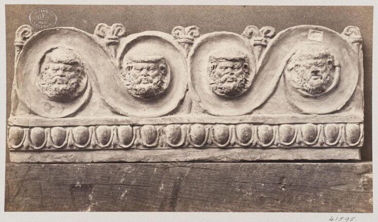 Bas-relief scroll with four masques in terra cotta top image