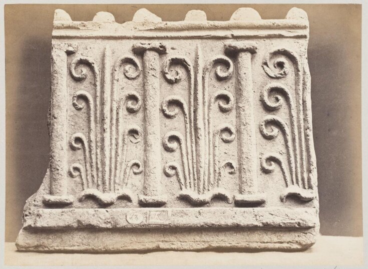 Bas-relief portion of frieze with palmettes and columns in terra cotta top image