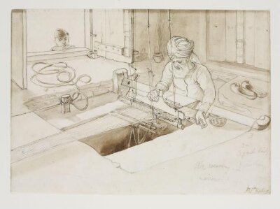 A turbaned man weaving silk on a pit loom