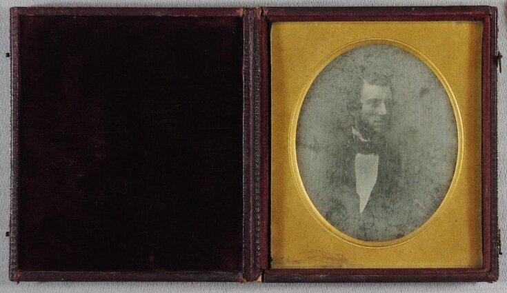 Oval portrait of a man top image
