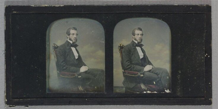 Stereoscopic hand-tinted daguerreotype depicting a portrait of a young man top image