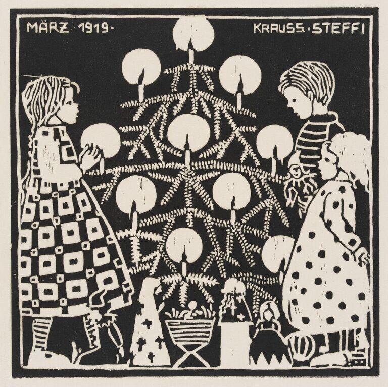 Three children standing by a Christmas tree