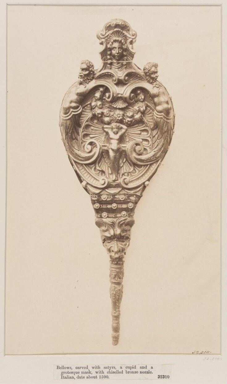 Bellows, carved with satyrs, a cupid and a grotesque mask, Italian, ca. 1500 top image