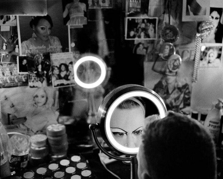 Felicity Carmichaels applying eye make-up in a dressing room backstage at the Darcelle XV Showplace, Portland, Oregon, USA, 2013 top image